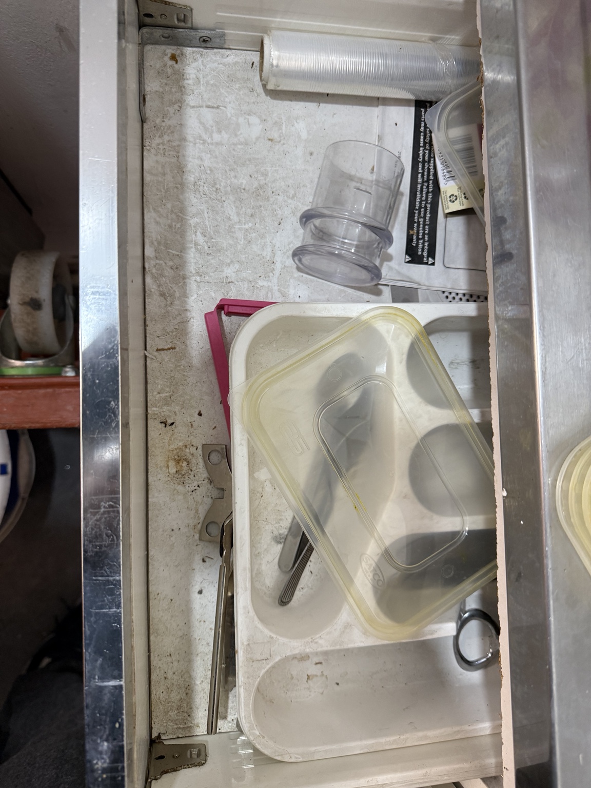 Kitchen drawer before deep cleaning
