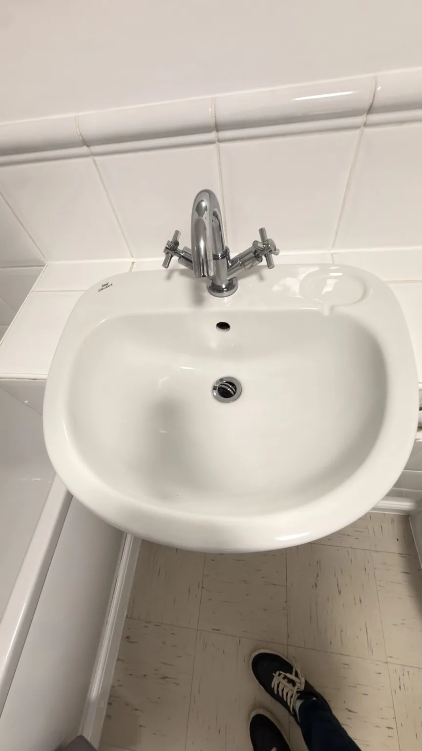 Clean bathroom basin and taps after RASO cleaning