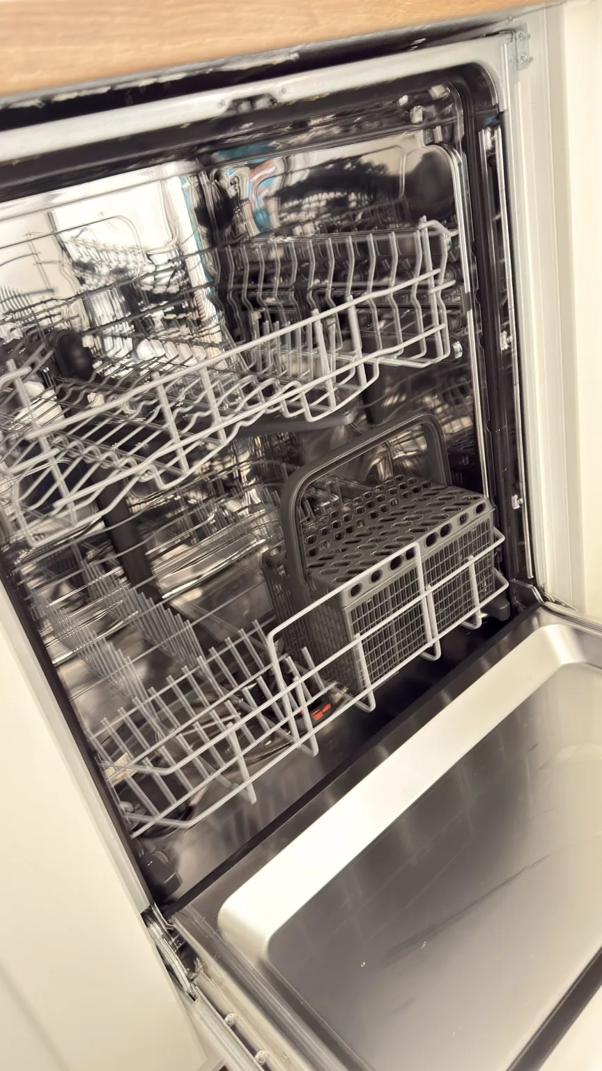 Clean dishwasher interior after professional appliance cleaning