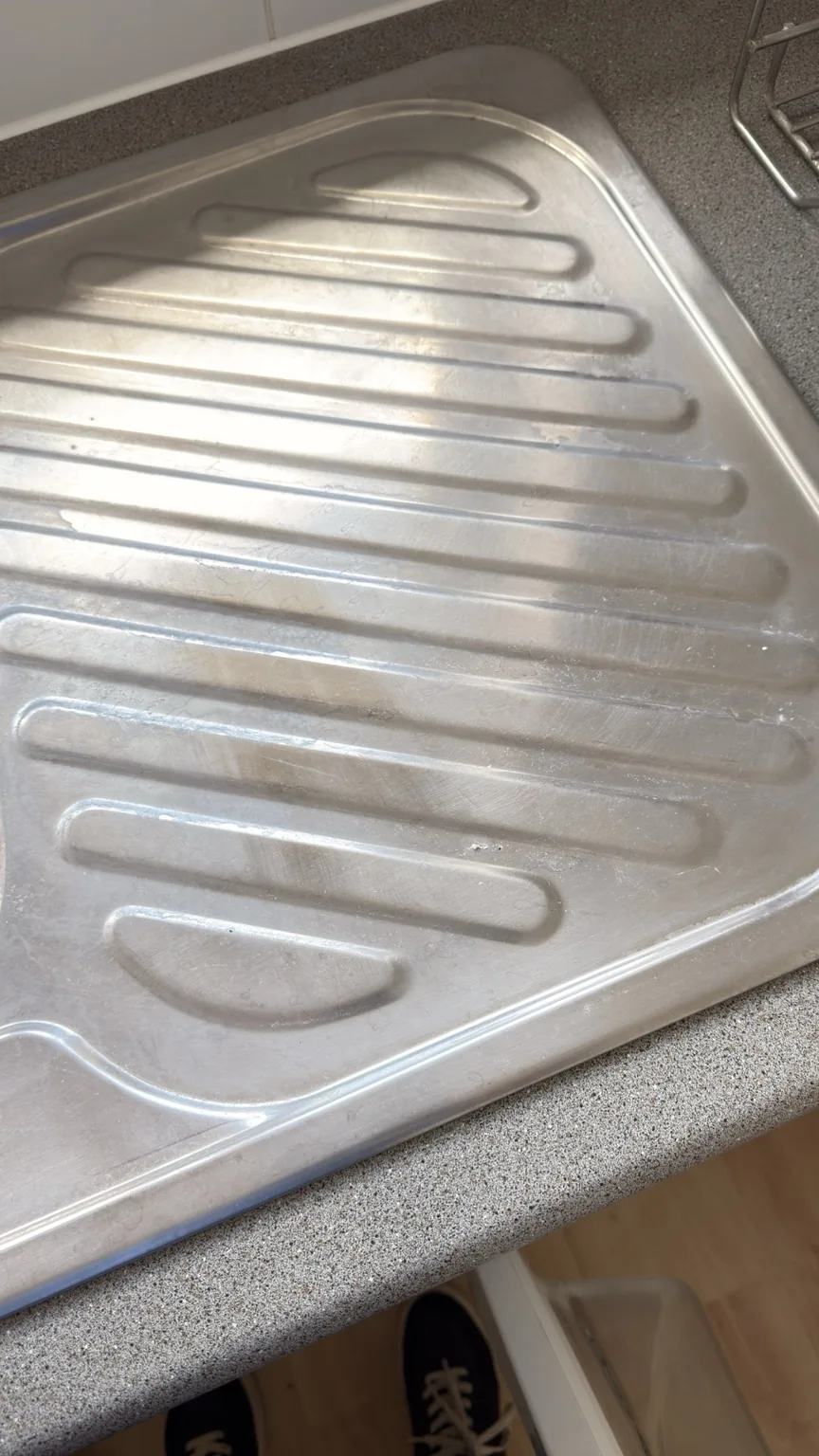 Stainless steel sink drainer before professional cleaning by RASO Cleaning Service