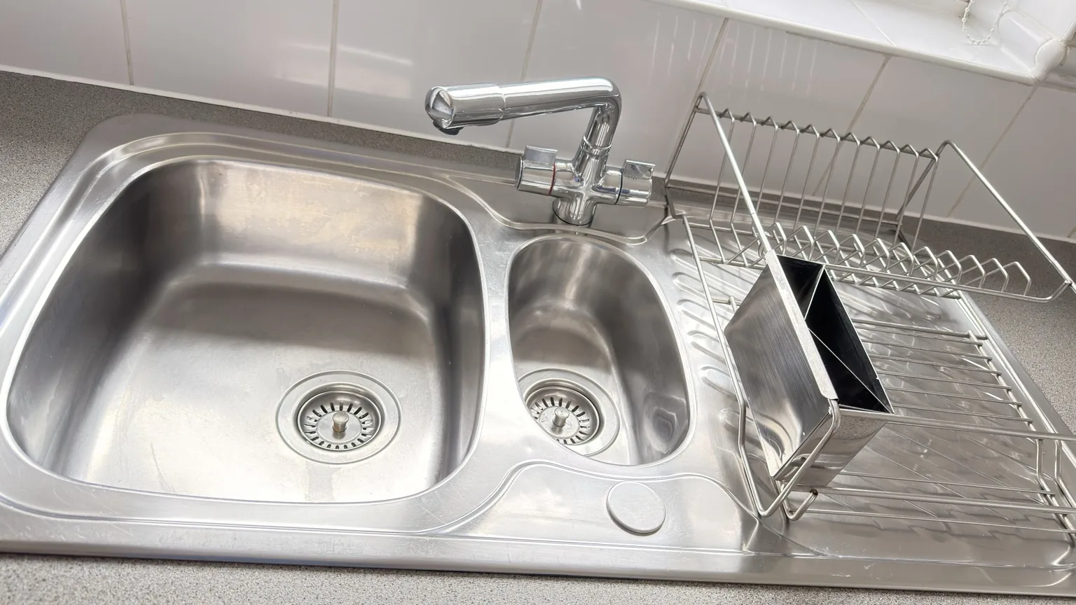 Stainless steel kitchen sink after professional cleaning by RASO Cleaning Service