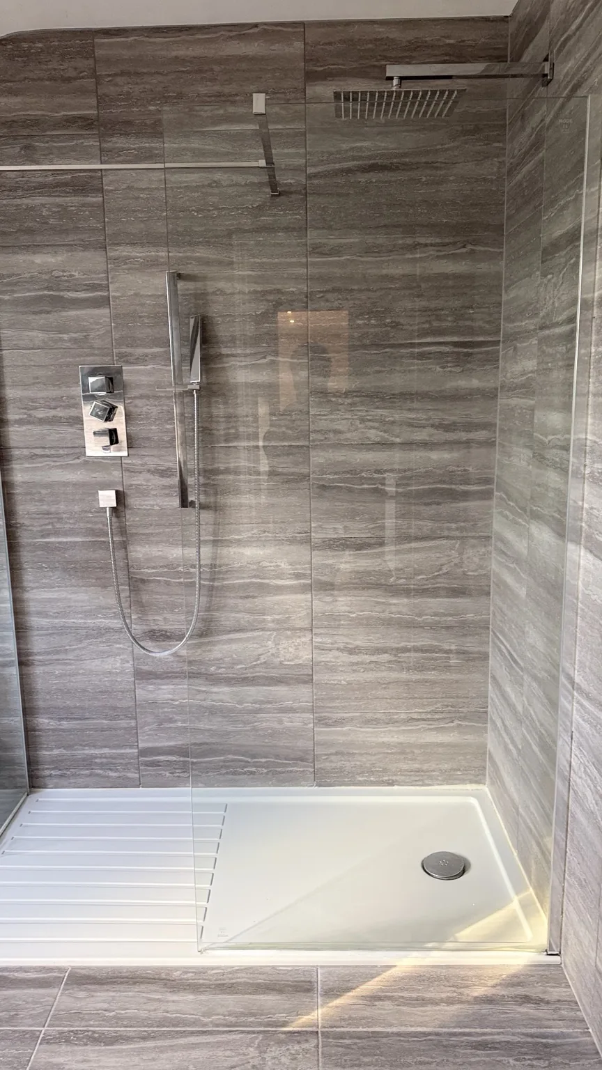 Clean tiled walk-in shower after RASO bathroom cleaning