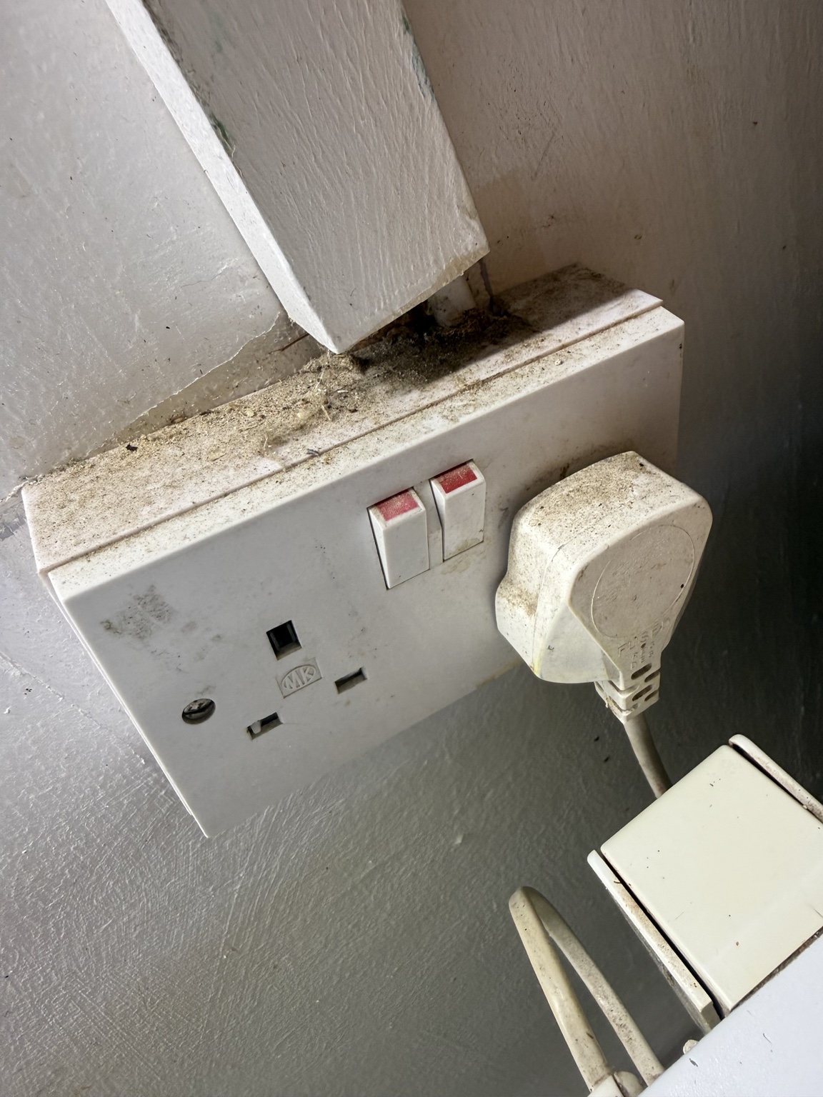 Electrical socket area before detailed move-in cleaning